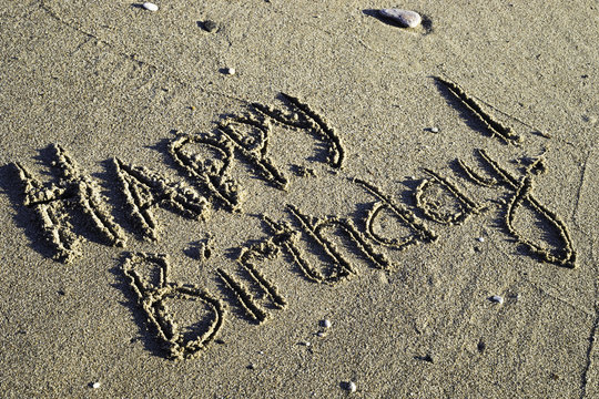 Words on the sand. Happy birthday!