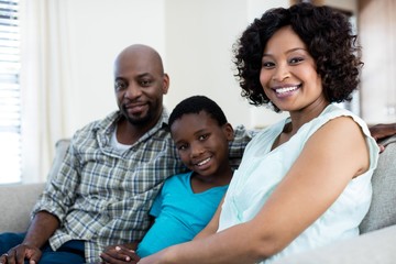 Fototapeta premium Portrait of mother, father and son in living room