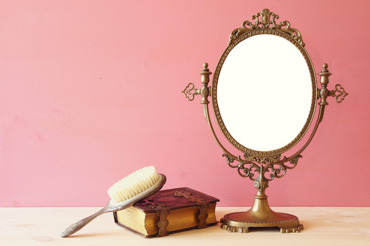 Old vintage oval mirror and woman toilet table