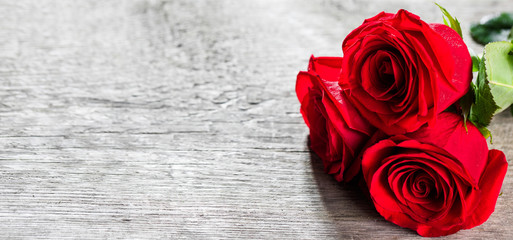 Red roses on wood