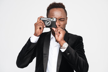 Handsome young african businessman make photo by camera