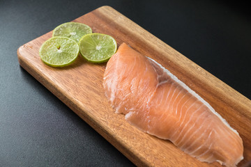 Fresh salmon on wooden tray