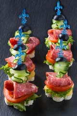 Rolgordijnen Canape on skewers with vegetables and sausage © 13smile