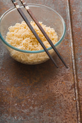 Soup Ramen noodles in glass bowl and wooden sticks