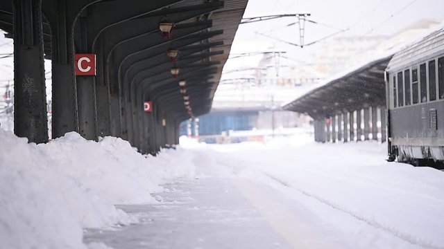 Trains waiting in train station after heavy snowfall