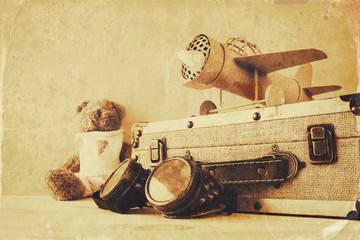 Photo of vintage toy plane and cute teddy bear