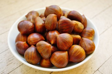 Bowl of fresh Italian chestnuts in the shell in winter
