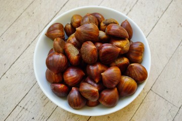 Bowl of fresh Italian chestnuts in the shell in winter