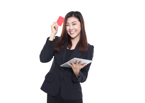 Business woman holding tablet and red card in hands isolated on white