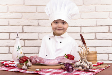 chef prepares a menu of raw rabbit