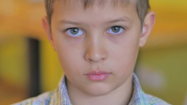 Portrait of a boy who looks into the camera. close-up footage