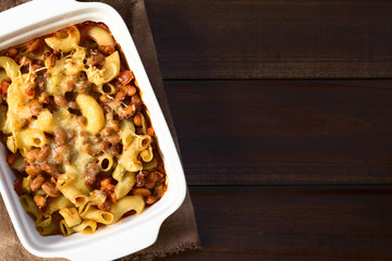 Chili con carne and macaroni pasta casserole in baking dish, photographed overhead with natural light (Selective Focus, Focus on the top of the casserole)
