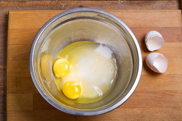 eggs, sugar. cooking ingredients in bowl. ready for mixing dough. cookbook. 