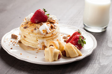 Fluffy Chocolate Chip Pancakes stacked with smokies