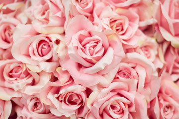 Bouquet pink artificial roses for background.