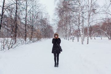 Winter portrait of a beautiful young woman.