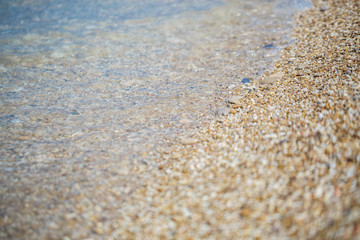 Fototapeta na wymiar Small stones on the beach