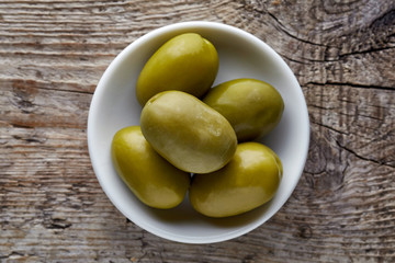 Bowl of green olives from above
