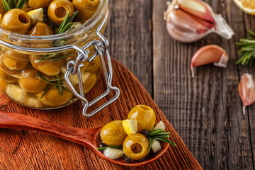 Fresh olives with rosemary, garlic, lemon.