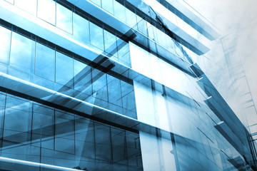 light blue background of glass high rise building skyscraper commercial modern city of future. Business concept of success industry tech architecture