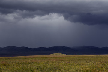 Fototapeta na wymiar Rain front extending over the steppe. Khakassia. Russia.