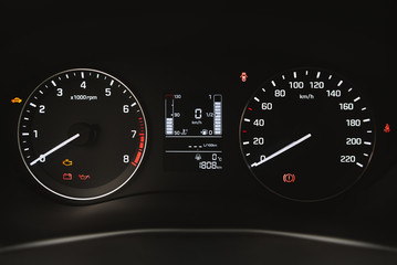 Car instrument panel, dashboard closeup with visible speedometer