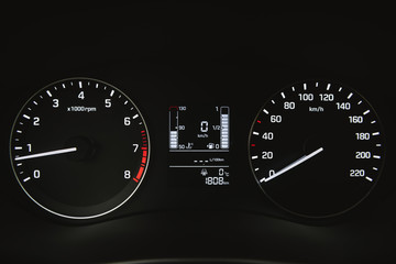 Fototapeta premium Car instrument panel, dashboard closeup with visible speedometer
