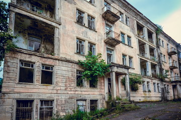 Naklejka premium Abandoned mining ghost-town Jantuha, Abkhazia. Destroyed empty houses 