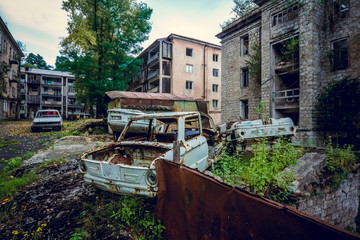 Fototapeta na wymiar Abandoned mining ghost-town Jantuha, Abkhazia. Destroyed empty houses 