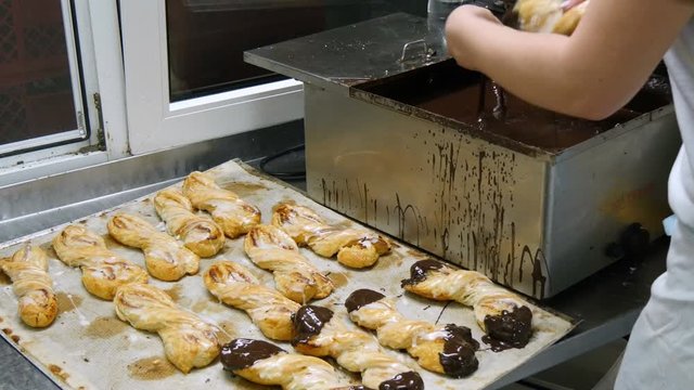 german baker dip pastery roll into liquid chocolate 4k 11695

