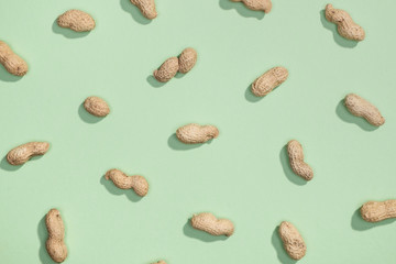 Fototapeta na wymiar Peanut nuts flat lay pattern