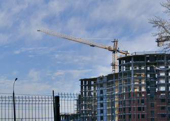 Large apartment buildings construction in winter sunny day