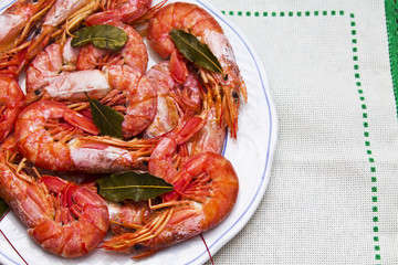 shrimp in the dish on flowered tablecloth
