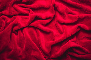 Red soft wrinkled fabric background.