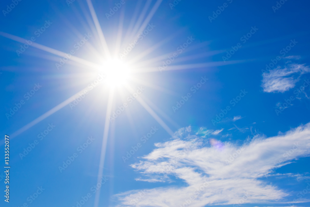 Wall mural blue sky with clouds and sun reflection.the sun shines bright in
