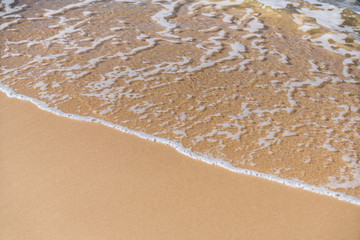 sea waves close-up on sand