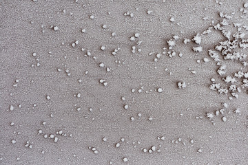 Frosty pattern of frozen snow on the surface