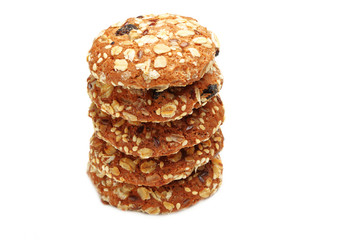 Cookies covered with nuts and raisins isolated on white background