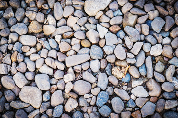 Round grey pebbles stones background