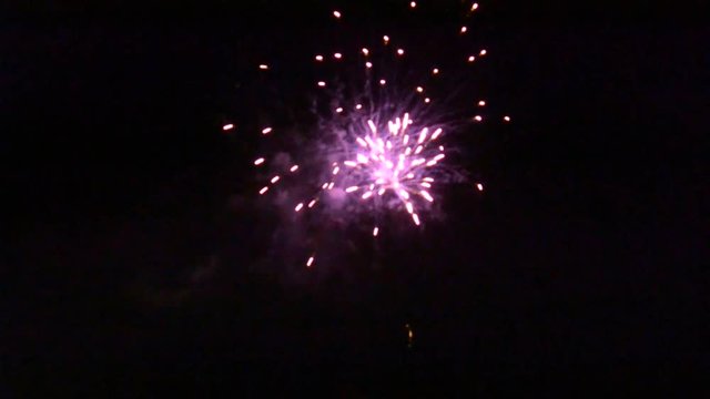 Colorful fireworks at night with sound of people celebrating