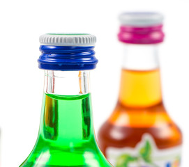 Various isolated liqueur bottles with party drinks