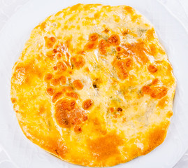 Khachapuri with meat on white plate