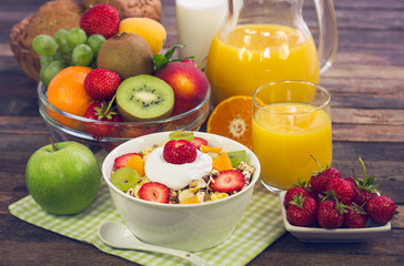 Healthy breakfast - muesli, yogurt, honey and fruits