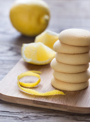 Biscuits filled with lemon cream on the wooden board