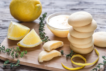 Biscuits filled with lemon cream on the wooden board