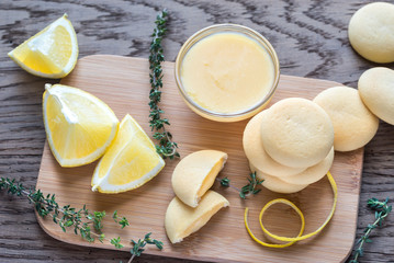 Biscuits filled with lemon cream on the wooden board