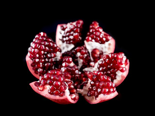 Pomegranate Fruit Spread Open Isolated by Black Background