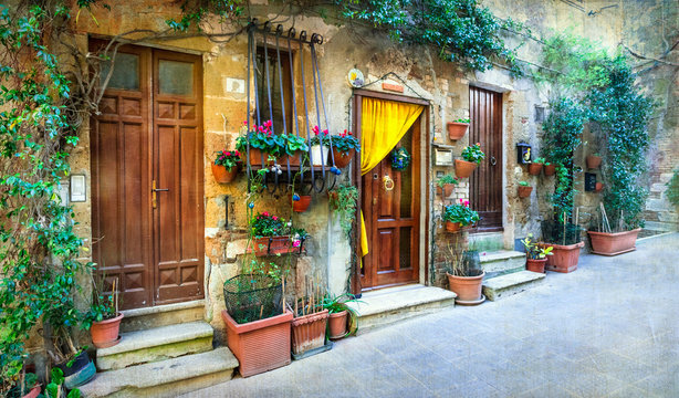 Fototapeta Charming floral streets of medieval towns of Italy. Pitigliano,Italy.Artistic picture