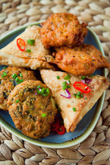 Spicy vegetable Indian snacks -  pakora, samosa, onion bhaji.