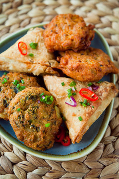 Spicy vegetable Indian snacks -  pakora, samosa, onion bhaji.
